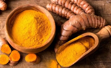 a bowl of turmeric powder and turmeric