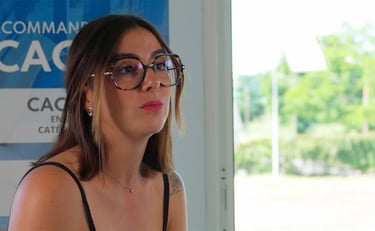 a woman in glasses and a black top