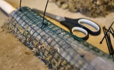 Self watering moss pole partially zipped shut with cable ties