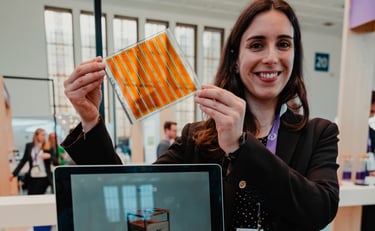 a woman holding a solar pannel (DSSC) - dye sensitized solar cell