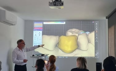 a group of people in a room with a projector