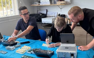 a man and a woman are working on the table