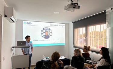 a man standing in front of a presentation on a presentation