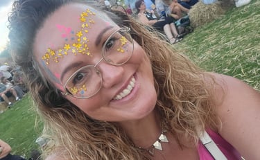 Pretty girl in festival glitter enjoying the music and atmosphere