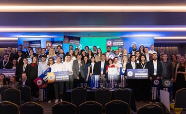 a group of people standing in front of a stage