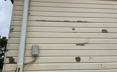 Before exterior painting in Zillmere showing peeling paint on weatherboards
