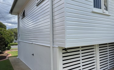 After exterior painting in Zillmere showing freshly painted white weatherboard