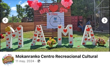 Large white MAMA letters with red hearts at Mokanranko Centro Recreacional for Mother's Day.