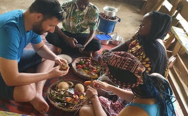 Tourists learning and experiencing traditional Zanzibar cooking techniques from local villagers 