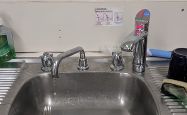 old leaking kitchen sink taps