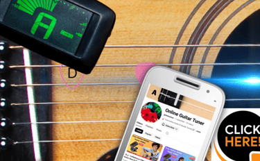 Digital clip-on guitar tuner and smartphone app used for tuning acoustic guitar strings.