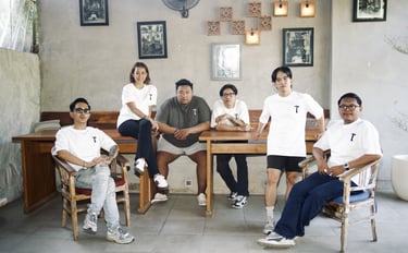 a group of people sitting around a table