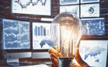 light bulb with computers and graphs in background representing marketing insights