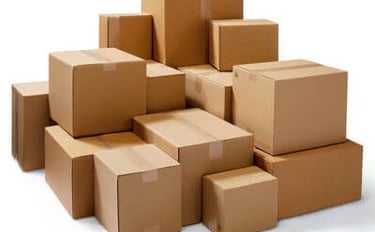 a pile of cardboard boxes with boxes on top