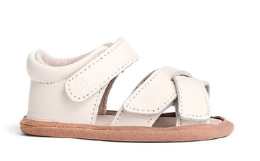 Product photography - a white baby's leather sandal with a strap