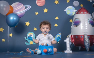 a baby boy in a space themed photo shoot