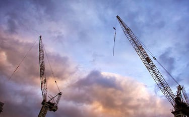 Steel Cranes with a sunset background