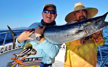 two men holding a fish