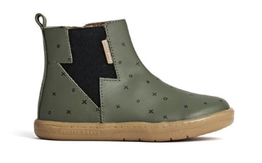 Product photography - a green boot with a black lightning strike