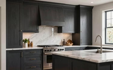 Photography of a high-end custom kitchen featuring charcoal-colored cabinetry with meticulously finished wood details. The scene is set in a luxury Portland residence with warm professional lighting and a commitment to modern professionalism.