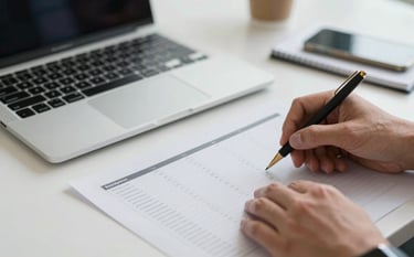 Close-up photography of professional hands reviewing data reports on a clean desk with a sleek laptop. Sharp focus, professional lighting, conveying expertise and precision in a North American corporate environment.