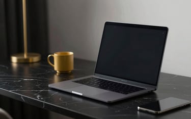 A high-end, minimalist workstation featuring a sleek laptop on a black marble desk. The lighting is moody and professional, with elegant gold accents on the desk accessories. Colors: #0A0A0A, #1C1C1C, #C9A961.