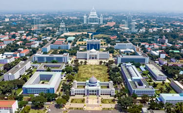An aerial view of a large collegiate campus in Tamil Nadu with architectural blueprints overlaid, representing a network of 500+ colleges. The lighting is bright and professional, emphasizing growth and educational opportunity with a sophisticated color palette of #1F3F6B and #507DA4.