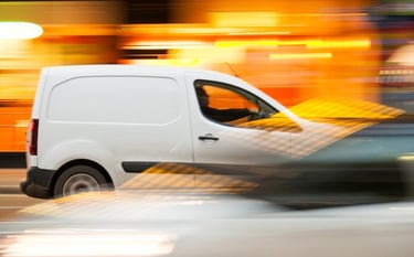 white cargo van on hot shot trucking run for urgent delivery