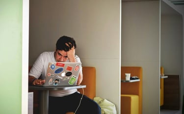 Office worker in Ballarat experiencing neck and back pain, treated with professional massage at Heal