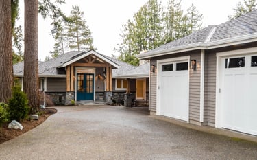 Front of the home with driveway and 2 car garage