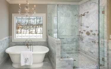 a bathtub with a chandelier and chandelier