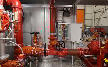 a fire hydrant with a red fire hydrant in the background