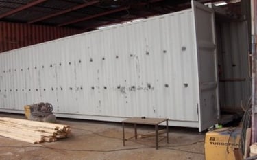 a container container house with a large container in the middle of it