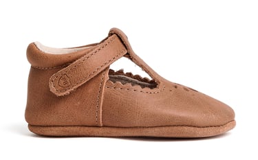 Product photography - a baby's shoe with a brown leatherette
