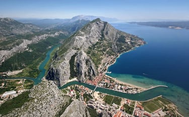 The photograph shows the city of Omis from the air perspective.