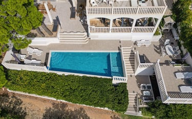 This picture shows the house and most of the yard taken from the air.