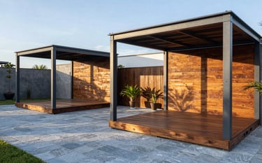 A high-end outdoor entertainment area in a South American / Latin American home, featuring a beautiful wood deck and a modern pergola. The structures are made of dark slate grey metal and warm timber. The lighting is soft morning sunlight, casting elegant shadows on the light blue-grey paving stones.