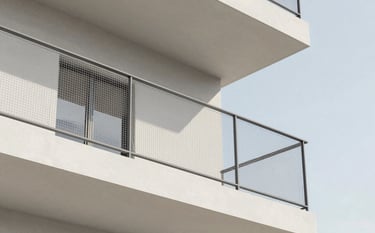 A close-up shot of a high-tensile safety net installed on a modern, minimalist balcony with clean Scandinavian lines. The lighting is bright and natural. Touches of #2E4C38 appear in the building's trim against the #F7F4EC wall, emphasizing a secure yet elegant home environment.