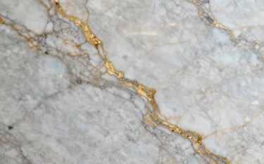A premium exotic marble slab with bold, dramatic patterns and gold veins. The lighting is sophisticated and directional, emphasizing the flawless polished finish. The scene represents ultimate luxury and corporate trustworthiness with #F8F8F8 and #A18A6A tones.