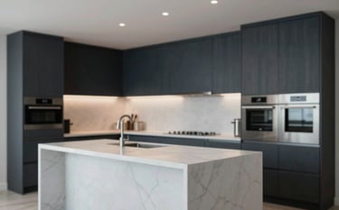 A high-end modern kitchen featuring sleek dark wood cabinets in #2C3E50, a large white marble island, and subtle integrated LED lighting. The style is sophisticated and minimalist, with stainless steel appliances and professional finishes. Cinematic lighting, photorealistic.