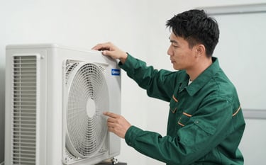 A professional property technician in a clean, dark green uniform inspecting a modern HVAC system in a bright utility room. The shot is a medium-close up, showing focus and expertise. The environment is orderly and clean, utilizing a palette of forest green and crisp whites.
