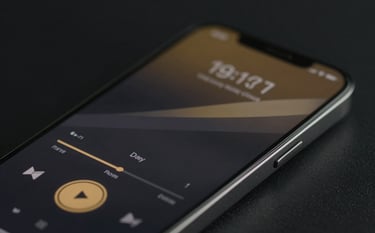 A close-up of a high-end smartphone displaying a sleek media player interface with dark glass textures and subtle gold playback controls. The lighting is moody and cinematic, emphasizing a premium technological feel. Colors: #0A0A0A background with #D4AF37 accents.