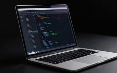 A close-up of a professional developer's workspace with a sleek, metallic laptop displaying clean code, set against a Deep Obsidian Black background with subtle Midnight Navy ambient lighting. The scene is minimalist and professional.