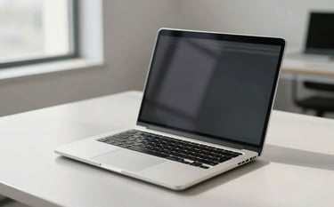 A clean, minimalist North American office setting featuring a high-end laptop on a light grey desk. The lighting is bright and natural, reflecting a sophisticated and professional tech environment with silver and off-white tones.