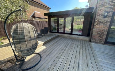 Walnut-composite-wood-garden-room-on-existing-decking