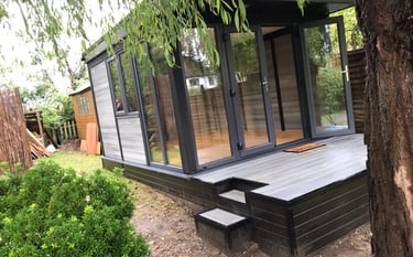 Light-grey-room-used-as-home-office-in-garden