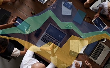 A graph over an image of people on tech devices to symbolise AU in retail