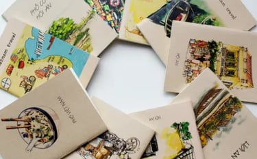 Hand-illustrated Vietnam travel notebooks and sketchbooks featuring watercolor art of Hoi An and Pho.