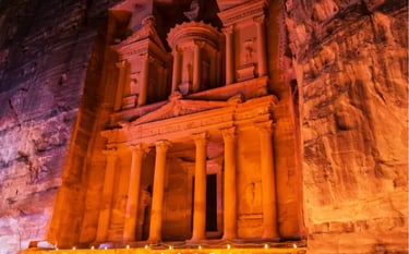 The Treasury at Petra, Jordan illuminated by candlelight at night in the ancient Nabatean city.