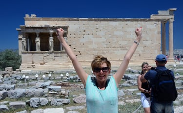 Lady Michelle celebrates making it atop the Acropolis in Athens, Greece